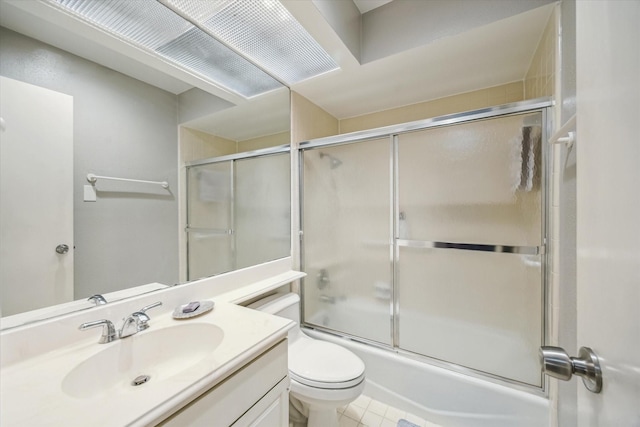5905 Sugar Hill Dr Unit 221, Houston, TX 77057 - full bath featuring toilet, vanity, bath / shower combo with glass door, and tile patterned flooring