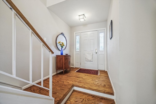 5905 Sugar Hill Dr Unit 221, Houston, TX 77057 - foyer featuring wood finished floors, stairway, and baseboards