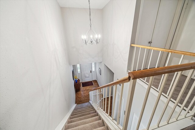 5905 Sugar Hill Dr Unit 221, Houston, TX 77057 - staircase with a chandelier