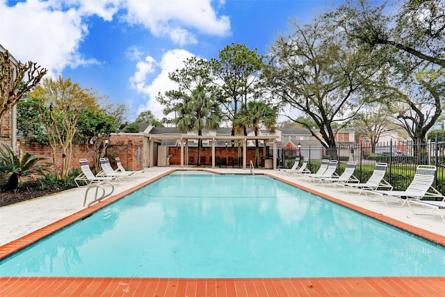 5905 Sugar Hill Dr Unit 221, Houston, TX 77057 - community pool with fence, a patio, and a residential view