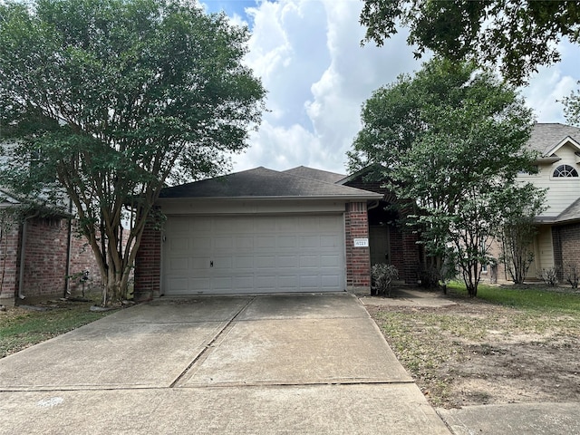6723 Highwind Bend Ln, Katy, TX 77449 - view of front of property featuring concrete driveway, brick siding, and a garage