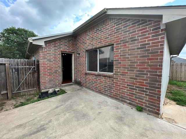 6723 Highwind Bend Ln, Katy, TX 77449 - exterior space featuring a patio area, fence, and brick siding