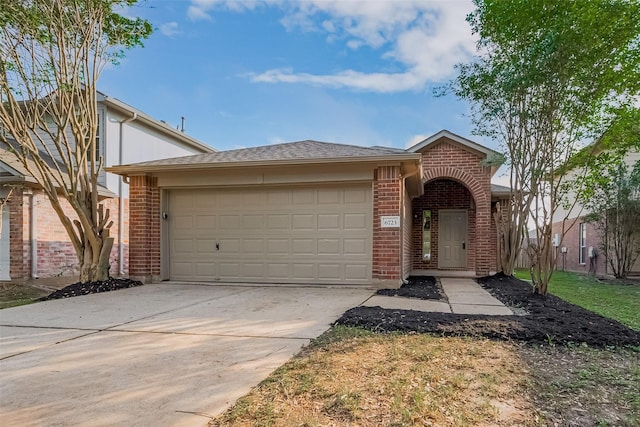 6723 Highwind Bend Ln, Katy, TX 77449 - view of front of house with brick siding, a garage, concrete driveway, and a shingled roof