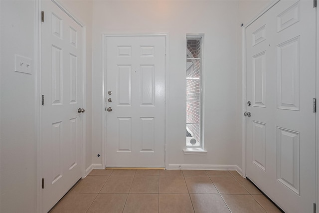 6723 Highwind Bend Ln, Katy, TX 77449 - entrance foyer featuring light tile patterned floors and baseboards