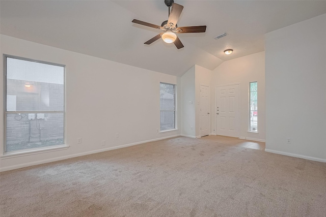 6723 Highwind Bend Ln, Katy, TX 77449 - empty room featuring light carpet, ceiling fan, baseboards, and vaulted ceiling