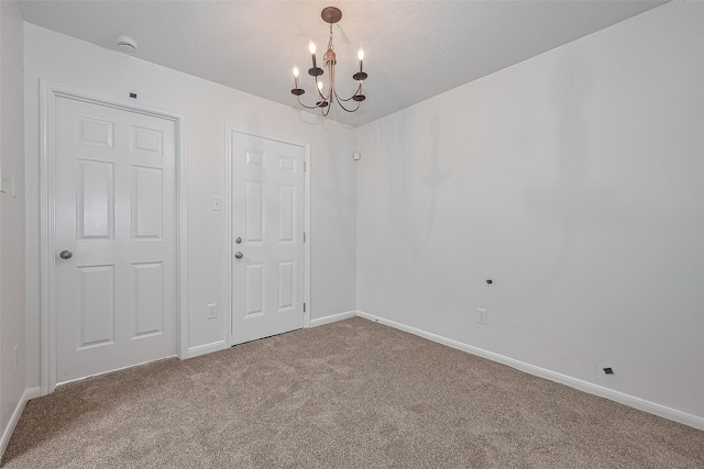 6723 Highwind Bend Ln, Katy, TX 77449 - carpeted spare room featuring a chandelier, a smoke detector, and baseboards