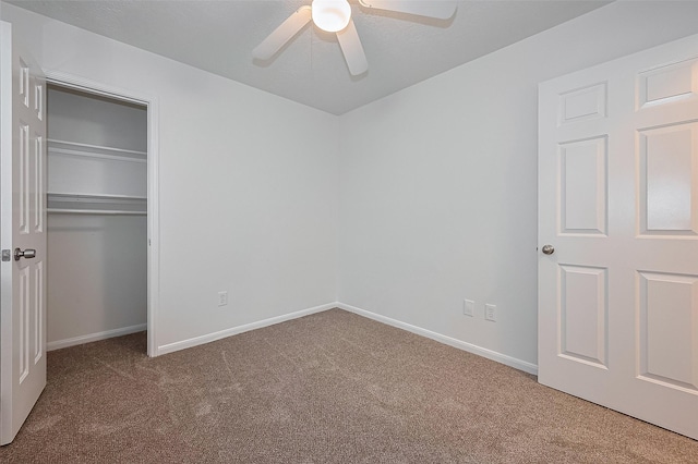6723 Highwind Bend Ln, Katy, TX 77449 - unfurnished bedroom with carpet flooring, baseboards, a closet, and ceiling fan