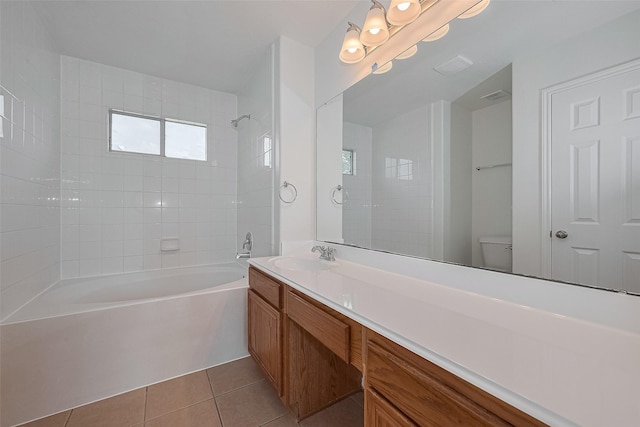 6723 Highwind Bend Ln, Katy, TX 77449 - bathroom featuring shower / tub combination, tile patterned floors, vanity, and toilet