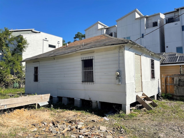 1210 Winter St, Houston, TX 77007 - view of home's exterior with fence and a shingled roof