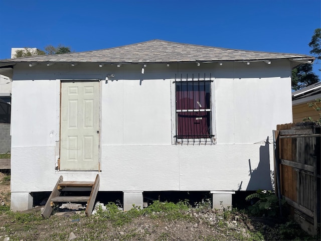 1210 Winter St, Houston, TX 77007 - back of property with entry steps, roof with shingles, and fence