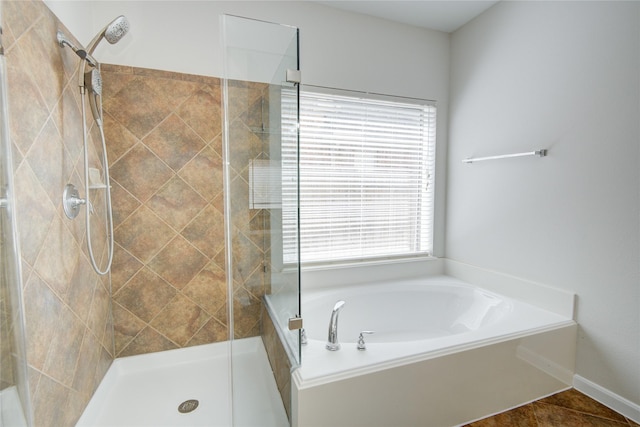full bath featuring a stall shower and a bath