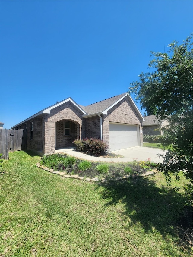 23716 Wood Green Terrace Dr, New Caney, TX 77357 - single story home with brick siding, a garage, and driveway