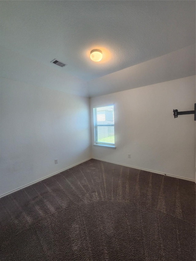 23716 Wood Green Terrace Dr, New Caney, TX 77357 - spare room featuring dark carpet and baseboards