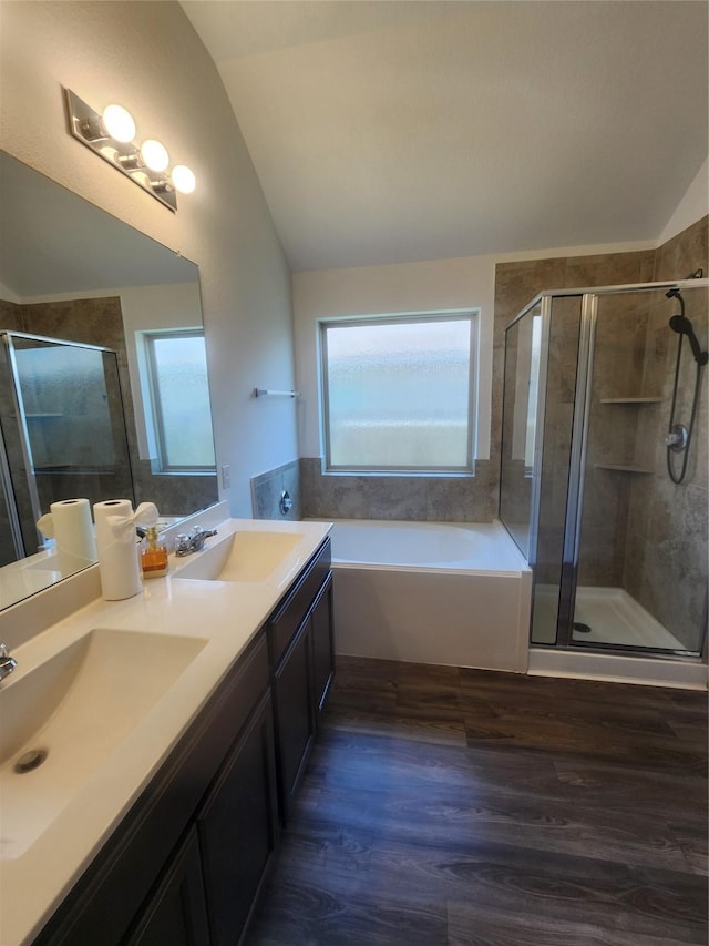 23716 Wood Green Terrace Dr, New Caney, TX 77357 - full bath featuring lofted ceiling, a shower stall, a garden tub, wood finished floors, and double vanity