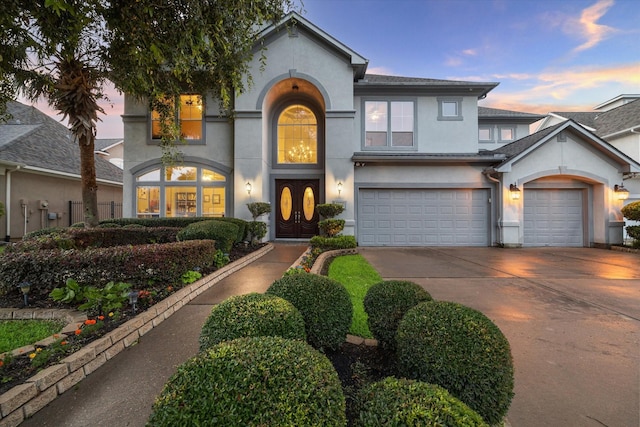 5214 Harvest Bend Ct, Sugar Land, TX 77479 - view of front facade with stucco siding, driveway, and an attached garage