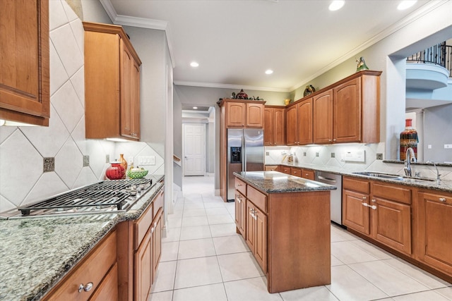 5214 Harvest Bend Ct, Sugar Land, TX 77479 - kitchen with a sink, appliances with stainless steel finishes, dark stone counters, a center island, and recessed lighting