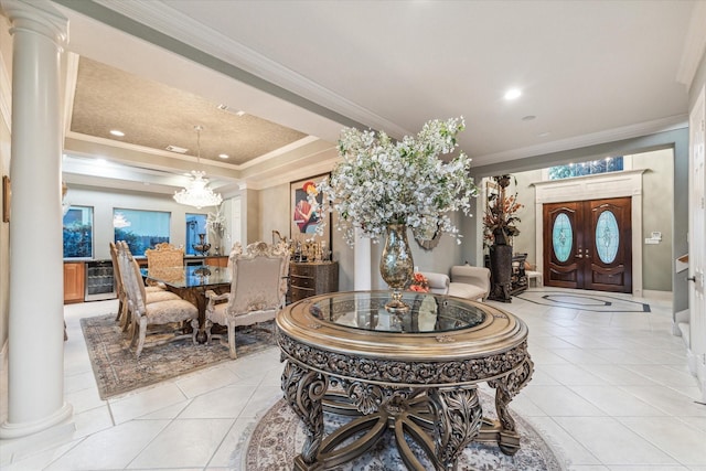 5214 Harvest Bend Ct, Sugar Land, TX 77479 - dining space featuring ornate columns, light tile patterned flooring, ornamental molding, a chandelier, and a raised ceiling