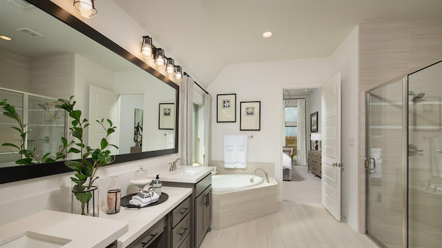 20315 Desert Foal Dr, Tomball, TX 77377 - bathroom with a stall shower, double vanity, a bath, recessed lighting, and ensuite bath