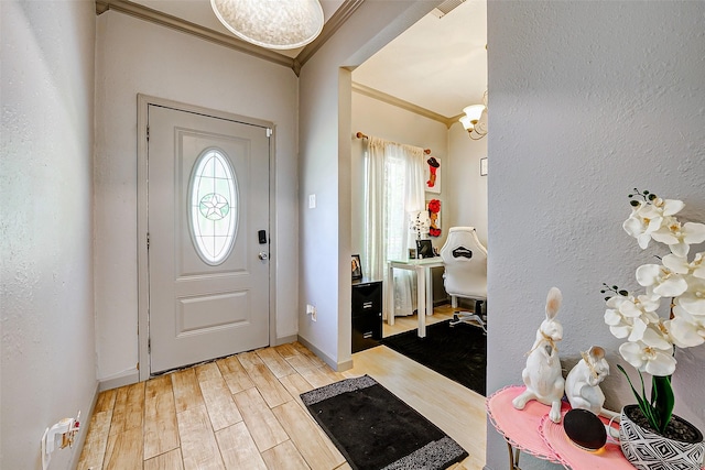 873 W Santa Fe St, Conroe, TX 77301 - entryway with crown molding, wood finished floors, baseboards, and a textured wall
