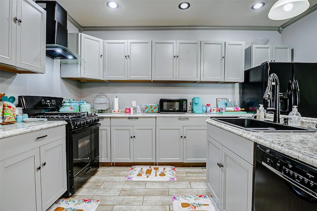 873 W Santa Fe St, Conroe, TX 77301 - kitchen featuring black appliances, a sink, wall chimney range hood, light countertops, and crown molding