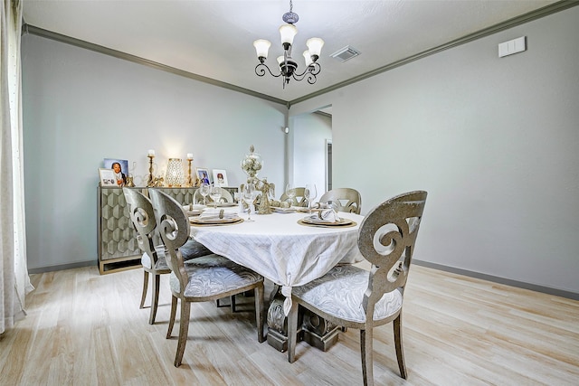873 W Santa Fe St, Conroe, TX 77301 - dining space with a chandelier, ornamental molding, light wood finished floors, and baseboards