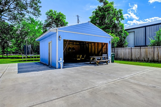 873 W Santa Fe St, Conroe, TX 77301 - detached garage with a trampoline and fence