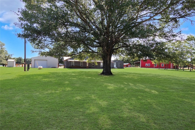 154 Lcr 893, Jewett, TX 75846 - view of green lawn featuring an outdoor structure and a garage