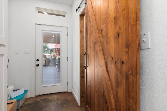 154 Lcr 893, Jewett, TX 75846 - doorway featuring unfinished concrete floors and a barn door