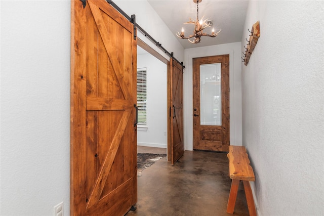 154 Lcr 893, Jewett, TX 75846 - entryway with a barn door, concrete flooring, a chandelier, a textured wall, and baseboards