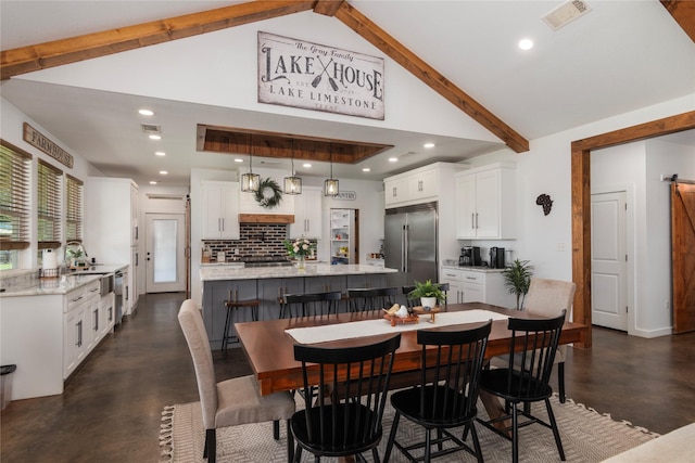 154 Lcr 893, Jewett, TX 75846 - dining area featuring finished concrete flooring, beam ceiling, recessed lighting, and high vaulted ceiling