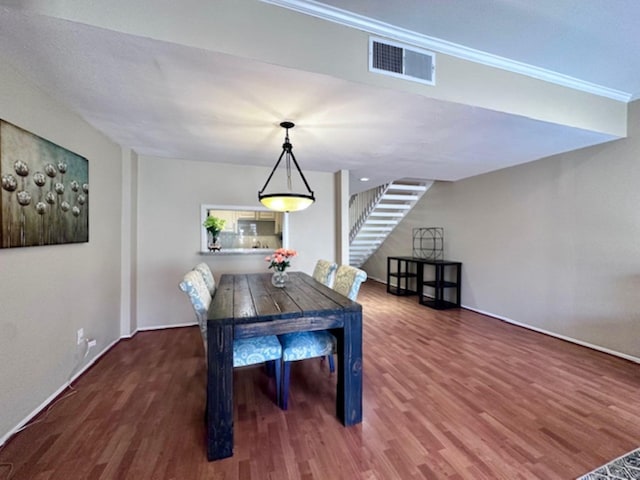 2228 S Piney Point Rd Unit 109, Houston, TX 77063 - dining area with wood finished floors, baseboards, ornamental molding, and stairway