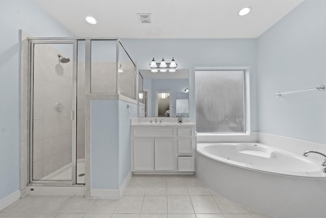 8910 Cote Ct, Houston, TX 77064 - bathroom featuring tile patterned floors, a shower stall, a garden tub, vanity, and baseboards
