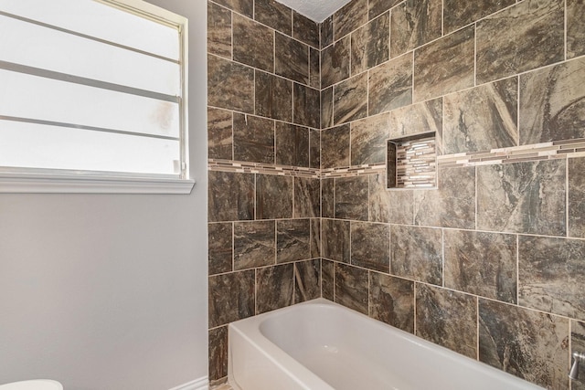 10056 Woodhollow Dr, Conroe, TX 77385 - full bath featuring shower / tub combination and baseboards
