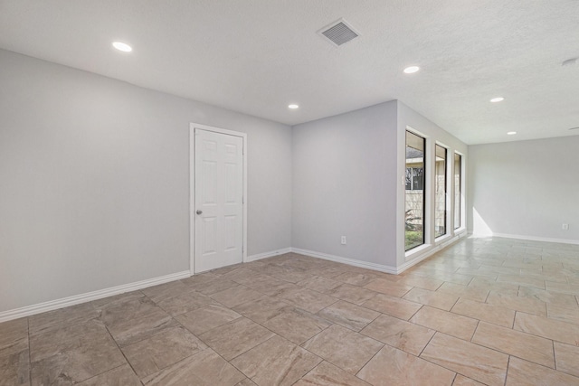 10056 Woodhollow Dr, Conroe, TX 77385 - spare room with recessed lighting and baseboards