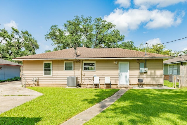 513 Gardenia St, Lake Jackson, TX 77566 - back of property with central AC and a shingled roof
