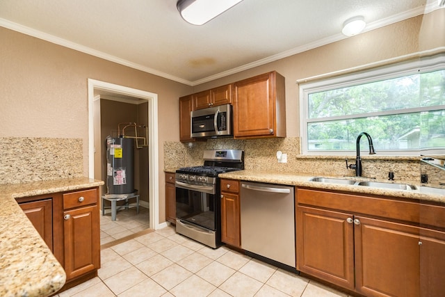 513 Gardenia St, Lake Jackson, TX 77566 - kitchen featuring appliances with stainless steel finishes, water heater, a sink, decorative backsplash, and ornamental molding