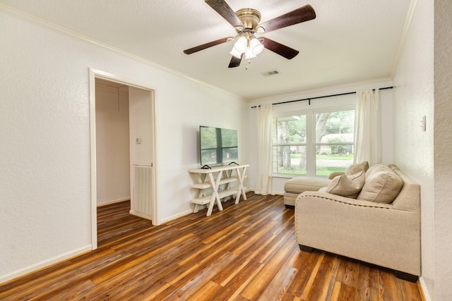 513 Gardenia St, Lake Jackson, TX 77566 - sitting room with ornamental molding, wood finished floors, ceiling fan, and a textured wall