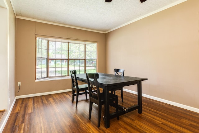 513 Gardenia St, Lake Jackson, TX 77566 - dining space with dark wood-type flooring, crown molding, baseboards, a textured ceiling, and a ceiling fan