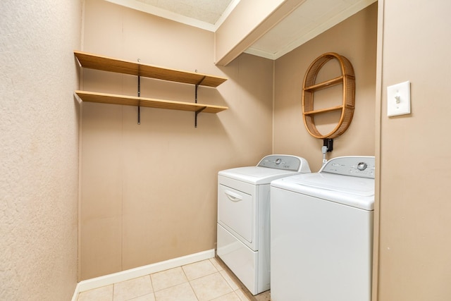 513 Gardenia St, Lake Jackson, TX 77566 - laundry room featuring washer and dryer, ornamental molding, and light tile patterned floors