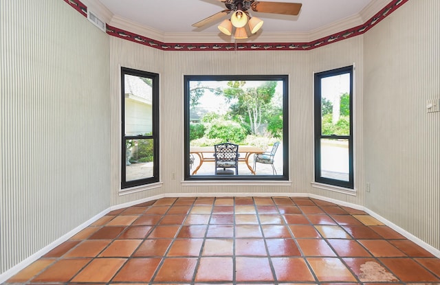 1023 Goldfinch Ave, Sugar Land, TX 77478 - doorway to outside with ornamental molding, healthy amount of natural light, a ceiling fan, tile patterned floors, and baseboards