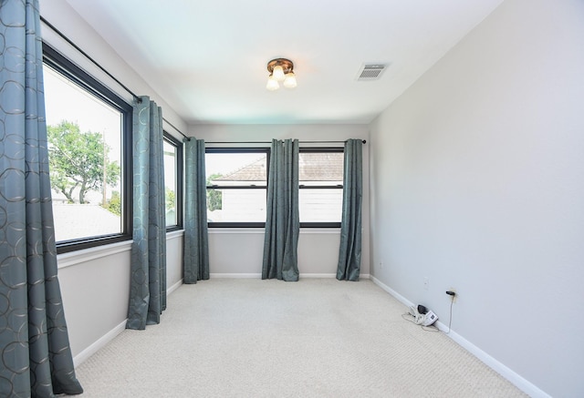 1023 Goldfinch Ave, Sugar Land, TX 77478 - carpeted empty room featuring plenty of natural light and baseboards