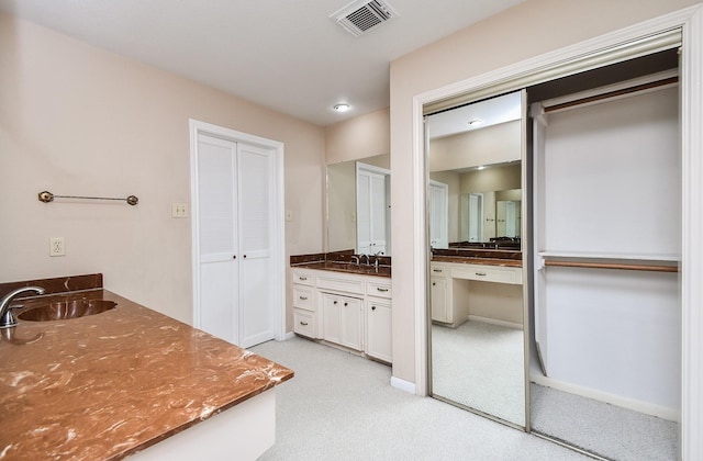 1023 Goldfinch Ave, Sugar Land, TX 77478 - full bathroom with vanity, a closet, and baseboards