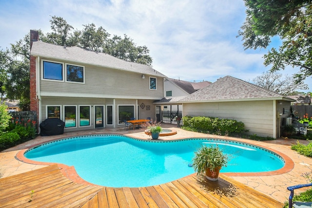 1023 Goldfinch Ave, Sugar Land, TX 77478 - view of swimming pool with fence and a patio area