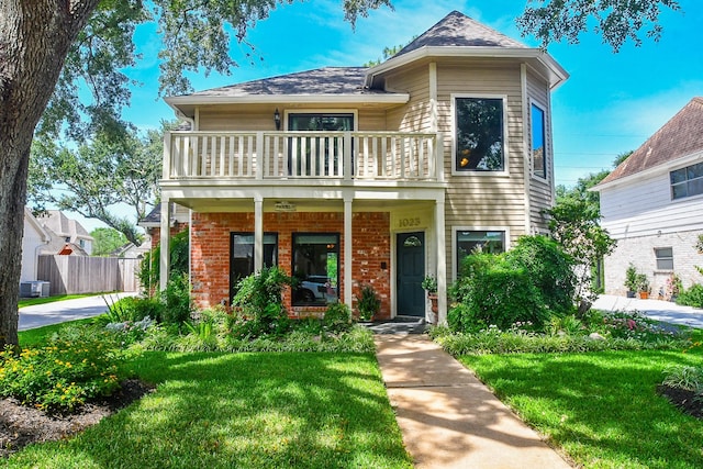 1023 Goldfinch Ave, Sugar Land, TX 77478 - view of front facade featuring a balcony and brick siding