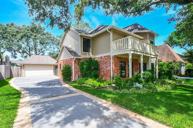 1023 Goldfinch Ave, Sugar Land, TX 77478 - view of front facade with brick siding, a balcony, and a detached garage