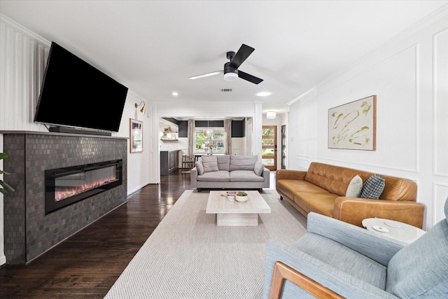 303 W 33rd St, Houston, TX 77018 - living area featuring a glass covered fireplace, dark wood-style floors, ceiling fan, crown molding, and recessed lighting