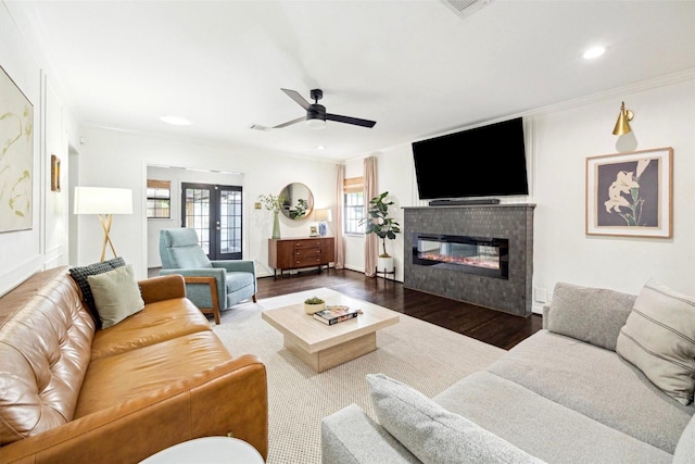 303 W 33rd St, Houston, TX 77018 - living area with wood finished floors, crown molding, ceiling fan, a fireplace, and recessed lighting