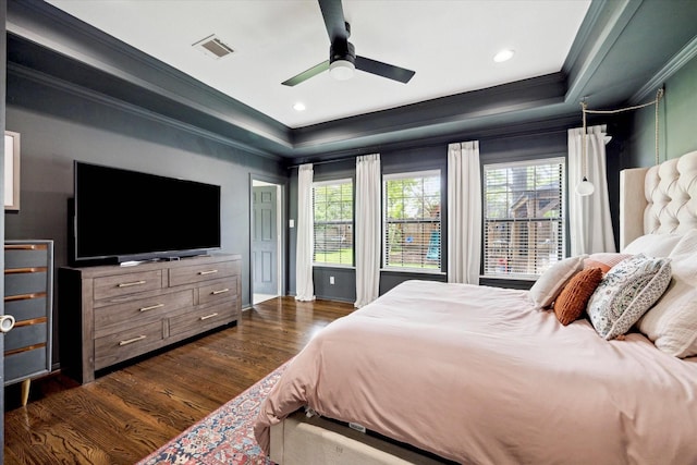 303 W 33rd St, Houston, TX 77018 - bedroom featuring a tray ceiling, ornamental molding, multiple windows, dark wood-type flooring, and a ceiling fan