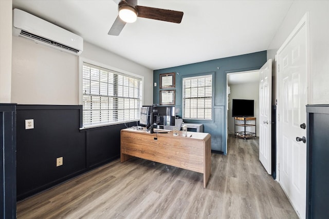 303 W 33rd St, Houston, TX 77018 - office featuring an AC wall unit, a ceiling fan, wood finished floors, and a wainscoted wall