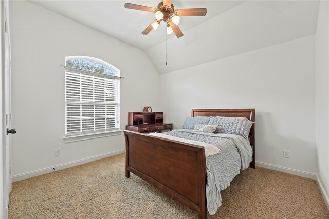 9210 Cold Hollow Ln, Missouri City, TX 77459 - bedroom with light carpet, baseboards, lofted ceiling, and ceiling fan